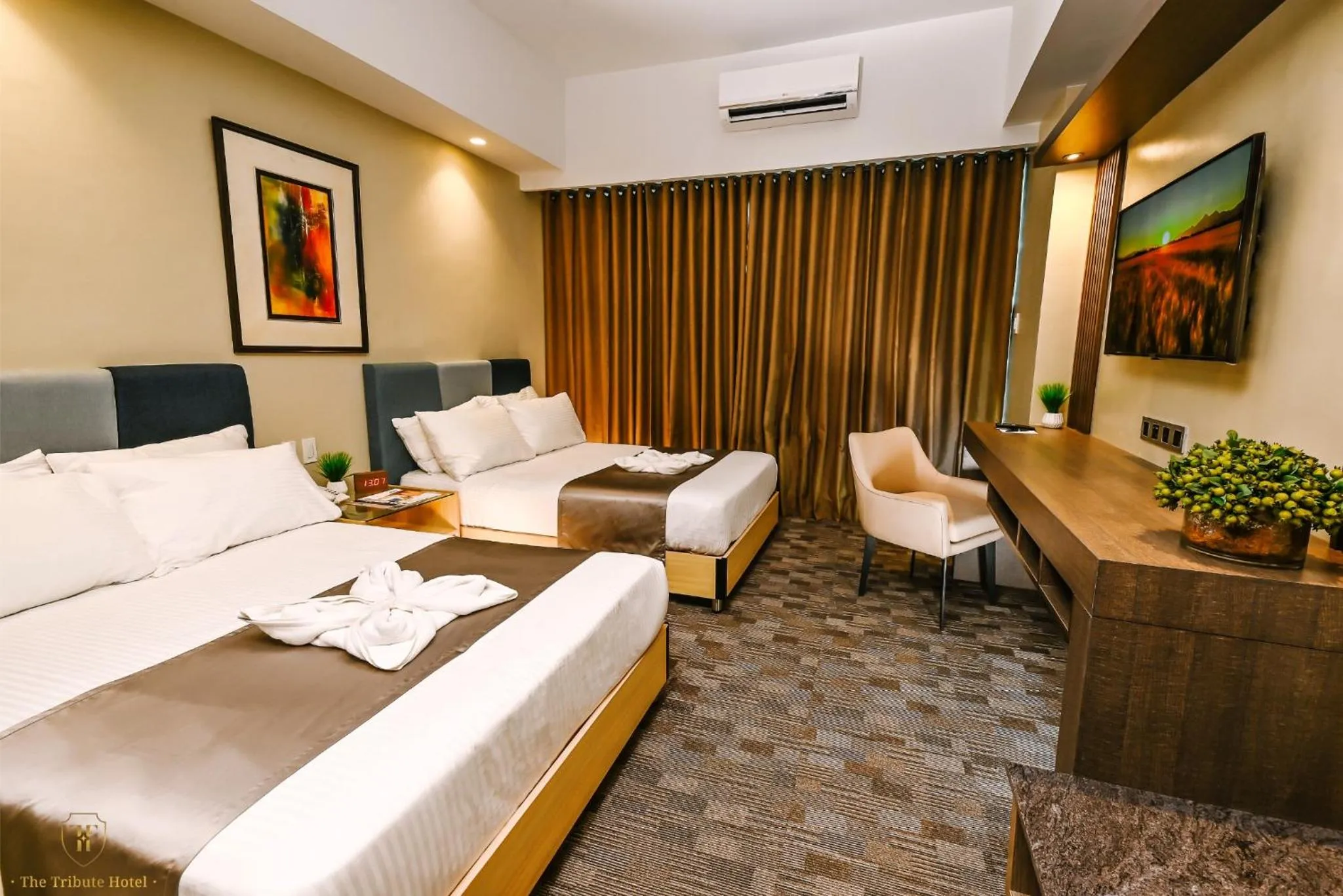 Bed in The Tribute Hotel