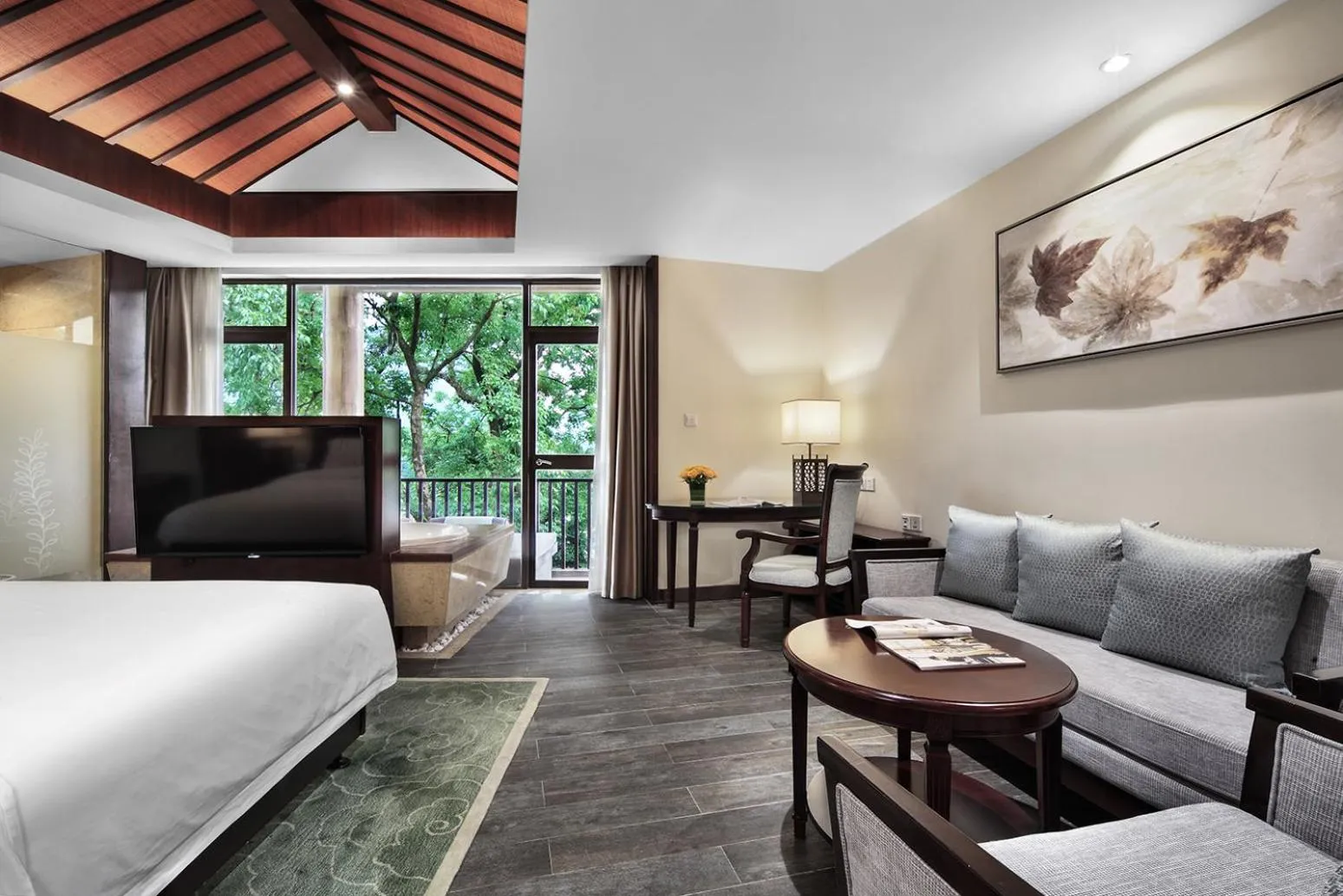 Seating area, Bed in Yangshuo Riverside Resorts Hotel