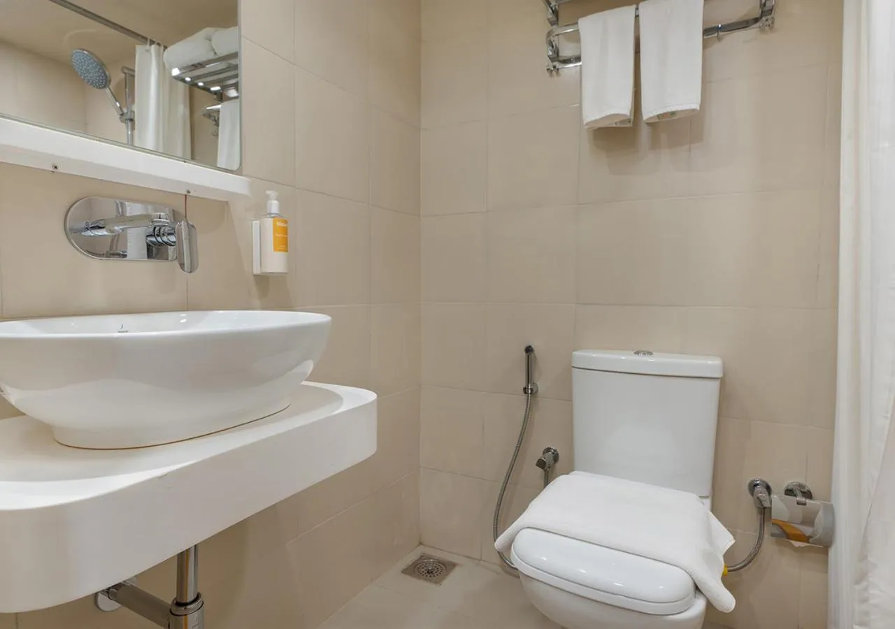 Toilet in Bloom Hotel - SG Highway