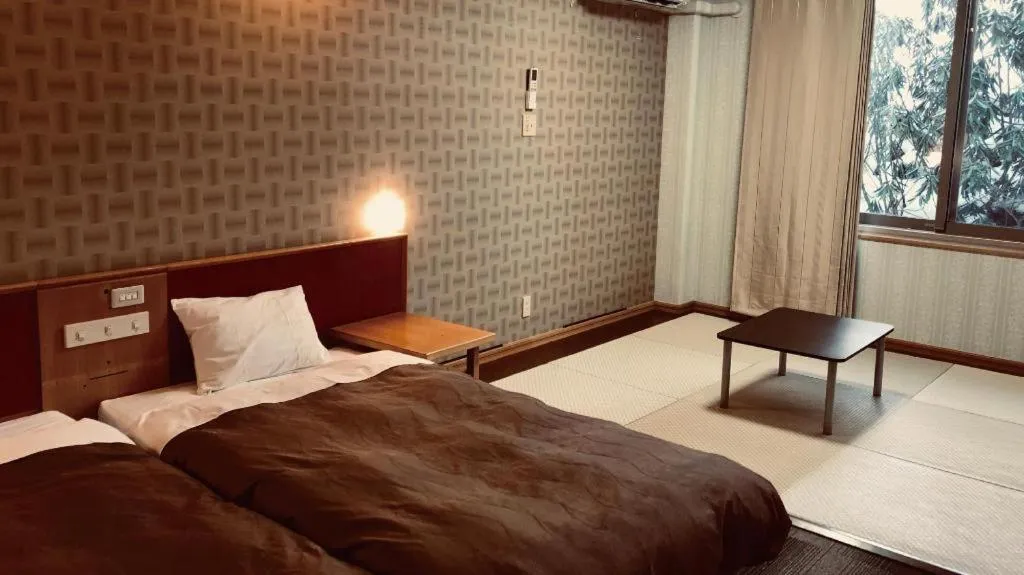 Bed in Ikenotaira Hotel