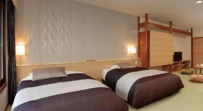 Bed in Ikenotaira Hotel