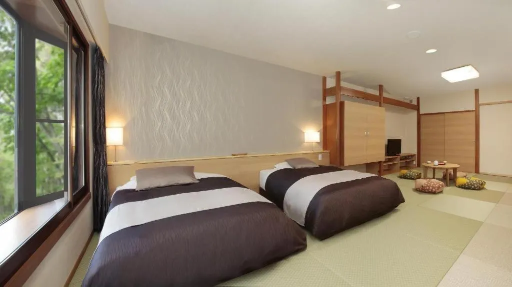 Bed in Ikenotaira Hotel