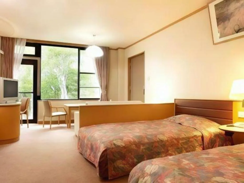 Bed in Ikenotaira Hotel