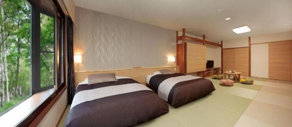Bed in Ikenotaira Hotel