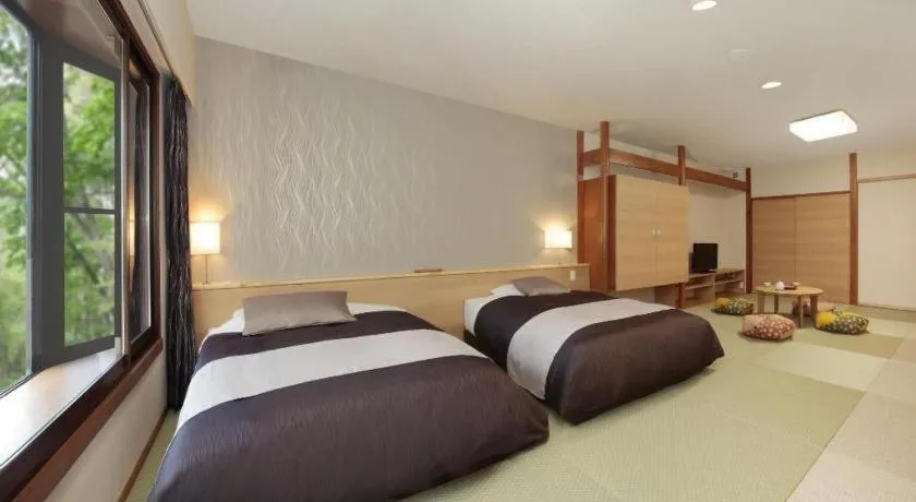 Bed in Ikenotaira Hotel