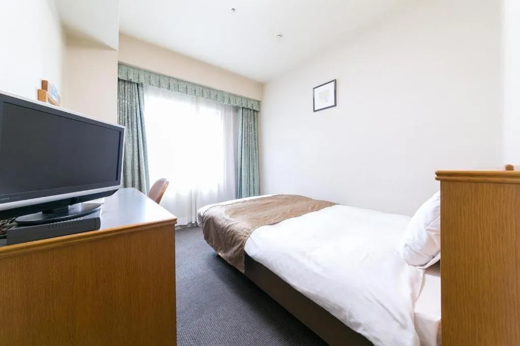 Bed in Pearl Hotel Ota