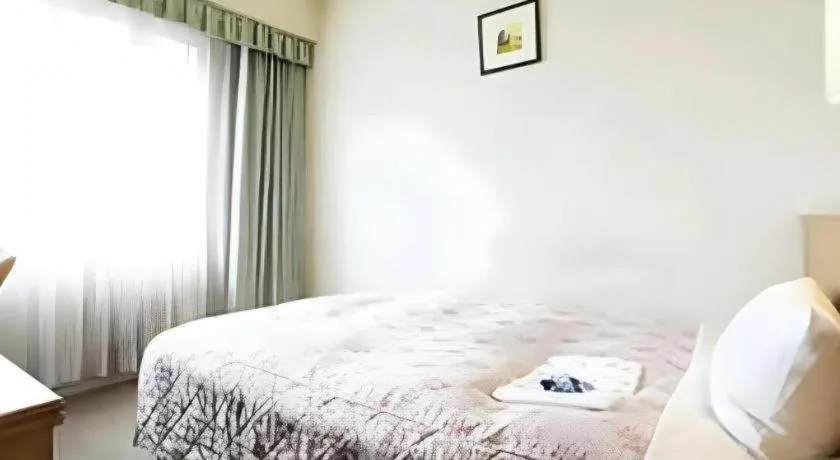 Bed in Pearl Hotel Ota