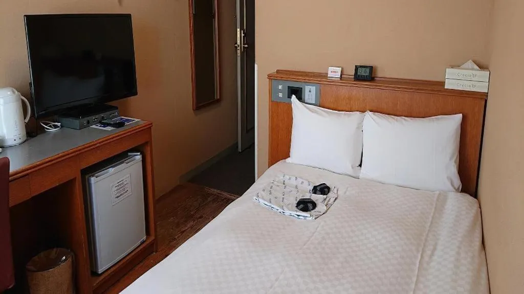 Bed in Pearl Hotel Ota