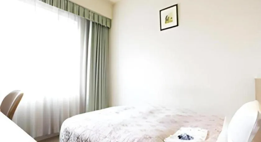 Bed in Pearl Hotel Ota