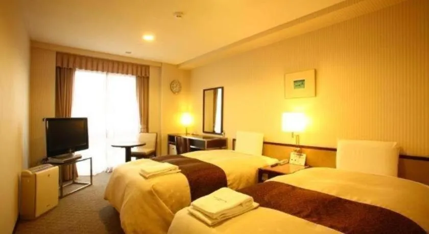 Bed in Hotel Sunroute Kyoto