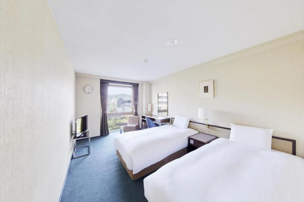 Bed in Hotel Sunroute Kyoto