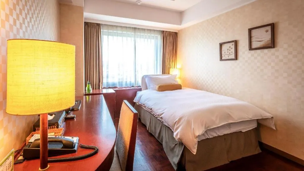 Bed in Miyazaki Kanko Hotel