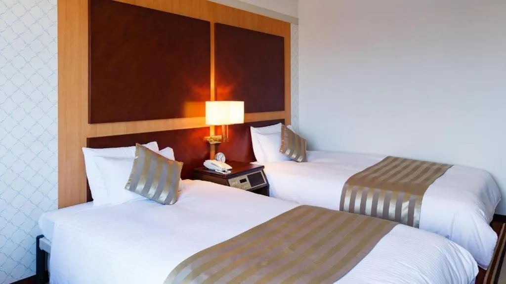 Bed in Miyazaki Kanko Hotel