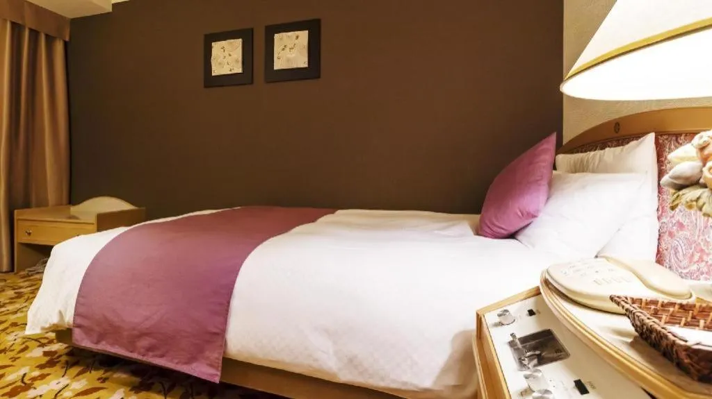 Bed in Miyazaki Kanko Hotel