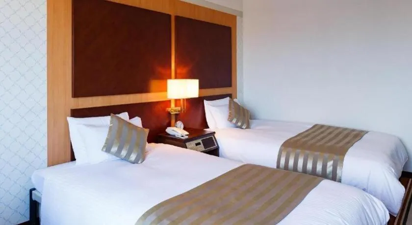 Bed in Miyazaki Kanko Hotel