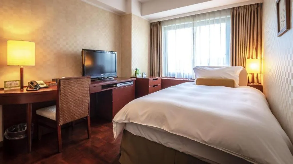 Bed in Miyazaki Kanko Hotel