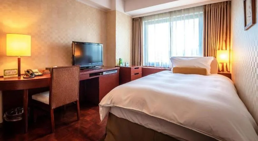 Bed in Miyazaki Kanko Hotel