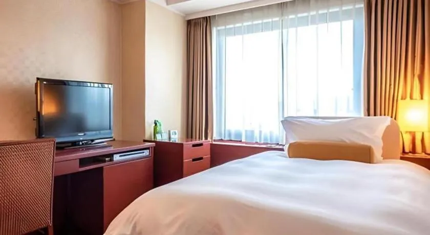 Bed in Miyazaki Kanko Hotel