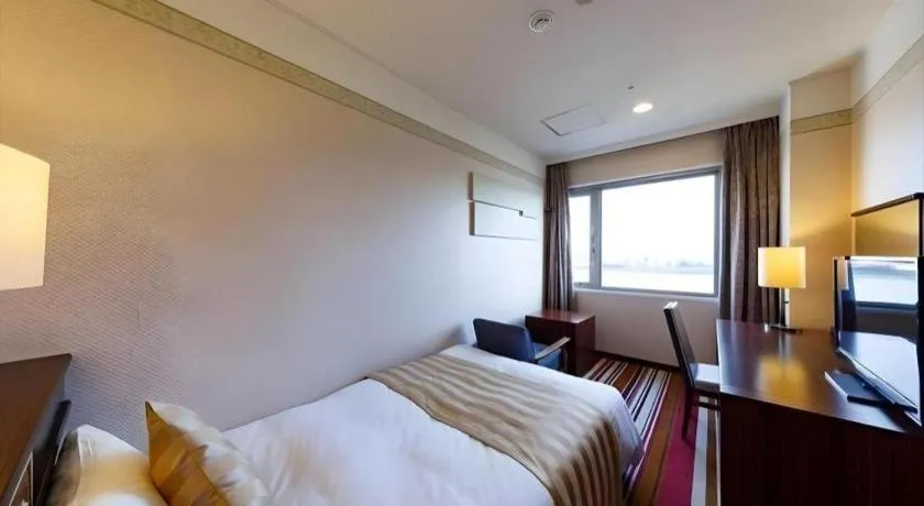 Bed in Miyazaki Kanko Hotel