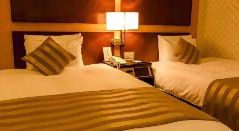 Bed in Miyazaki Kanko Hotel