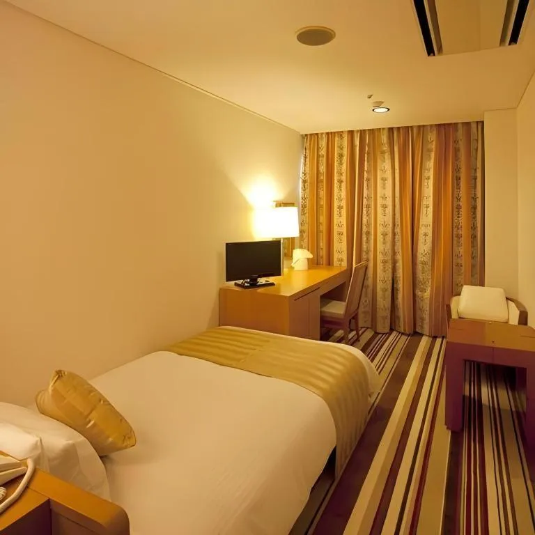 Bed in Miyazaki Kanko Hotel