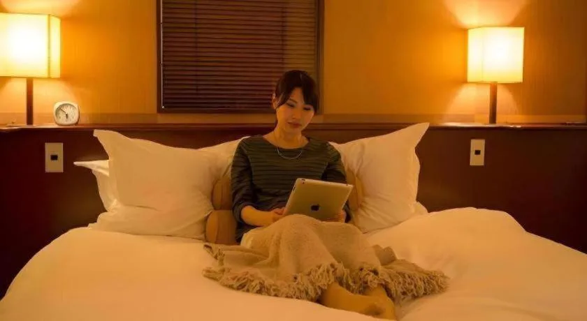 Bed in Miyazaki Kanko Hotel