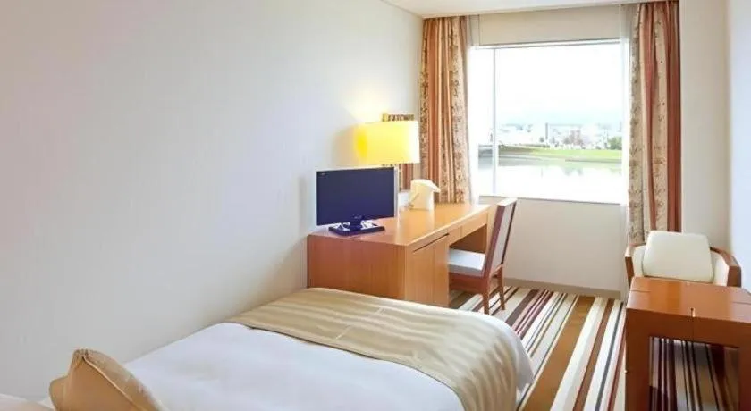 Bed in Miyazaki Kanko Hotel