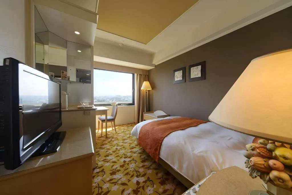 Bed in Miyazaki Kanko Hotel