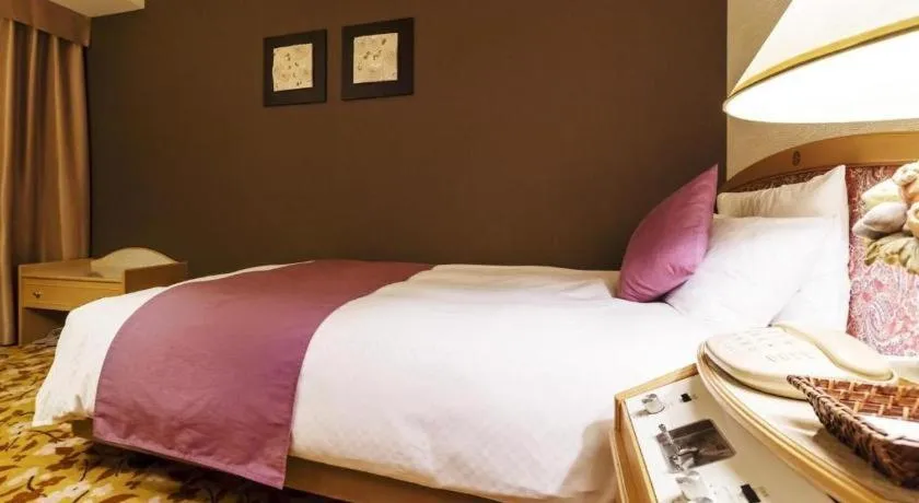 Bed in Miyazaki Kanko Hotel