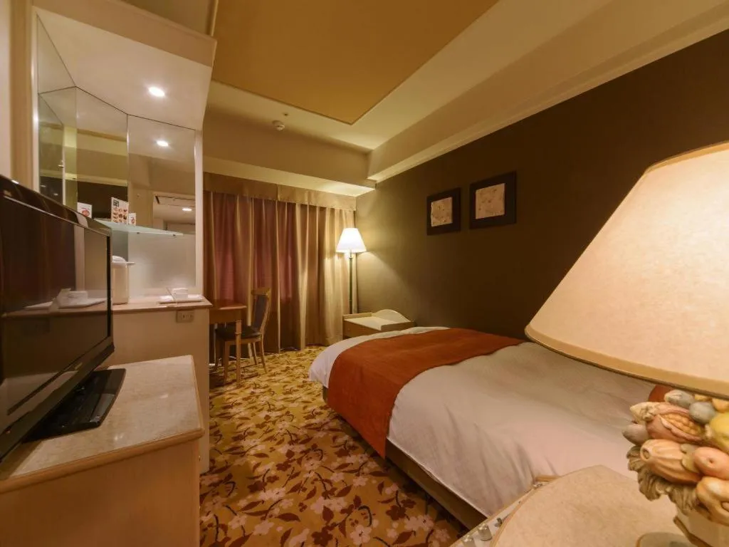 Bed in Miyazaki Kanko Hotel