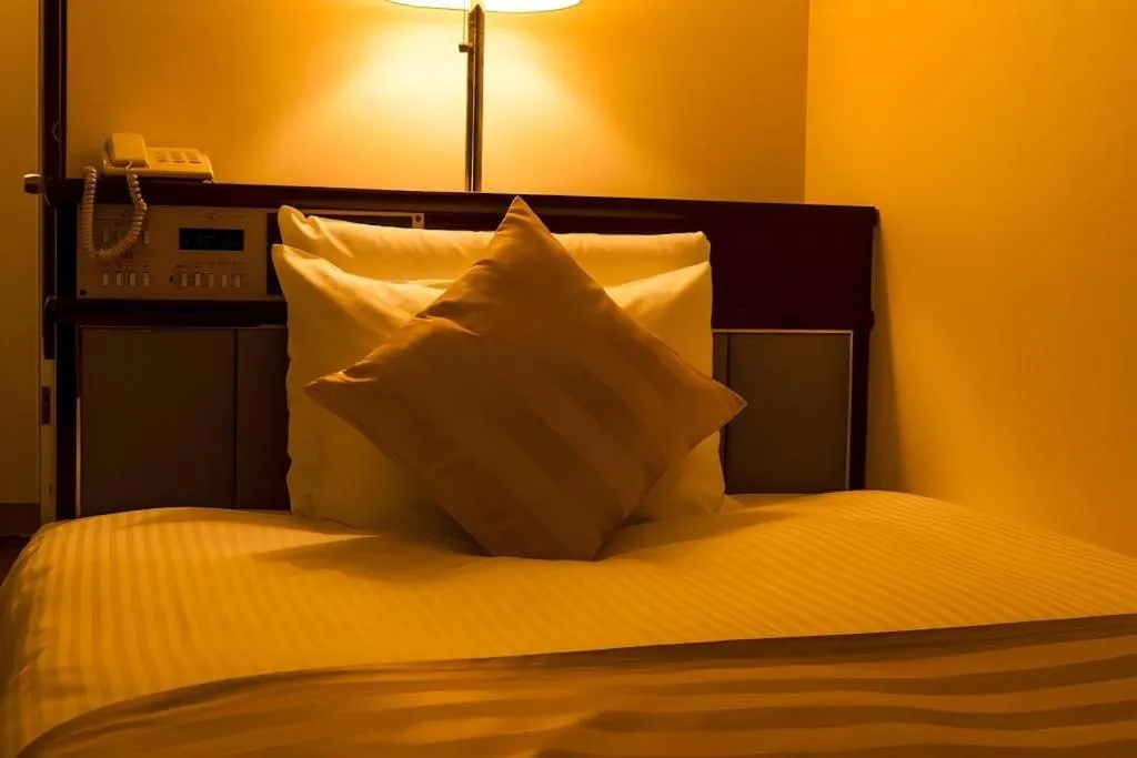 Bed in Miyazaki Kanko Hotel