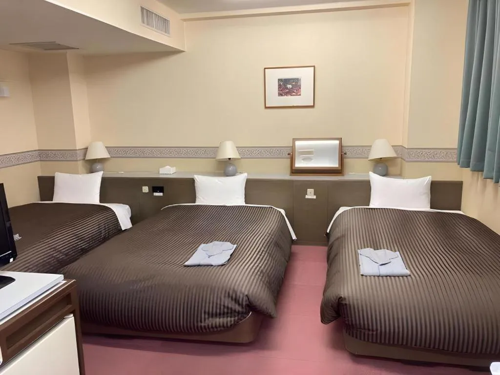 Bed in The Hamilton Sapporo Hotel