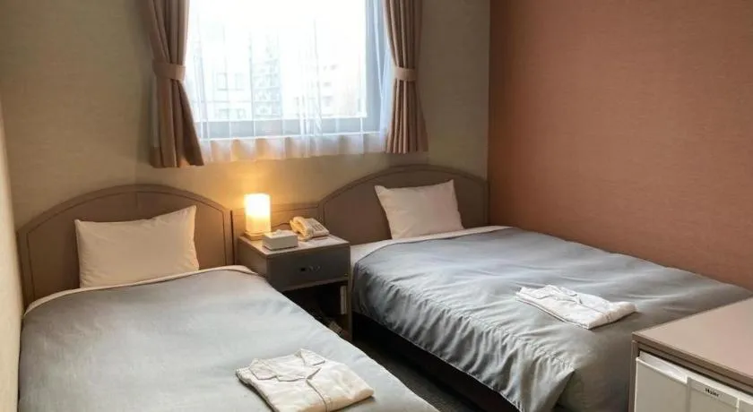 Bed in The Hamilton Sapporo Hotel