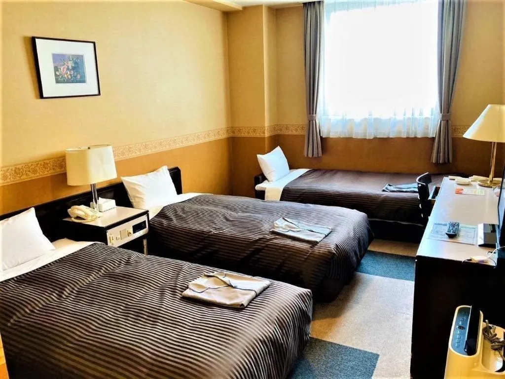 Bed in The Hamilton Sapporo Hotel