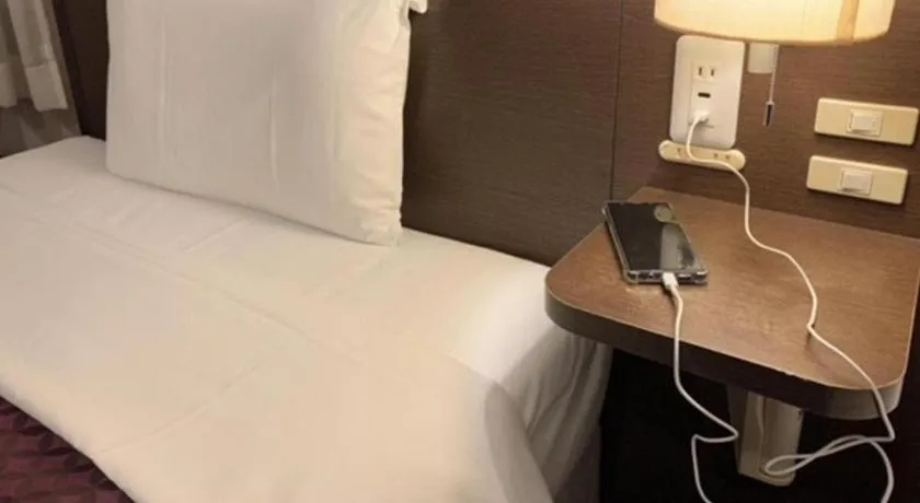 Bed in Hotel Park Side Hiroshima Peace Park