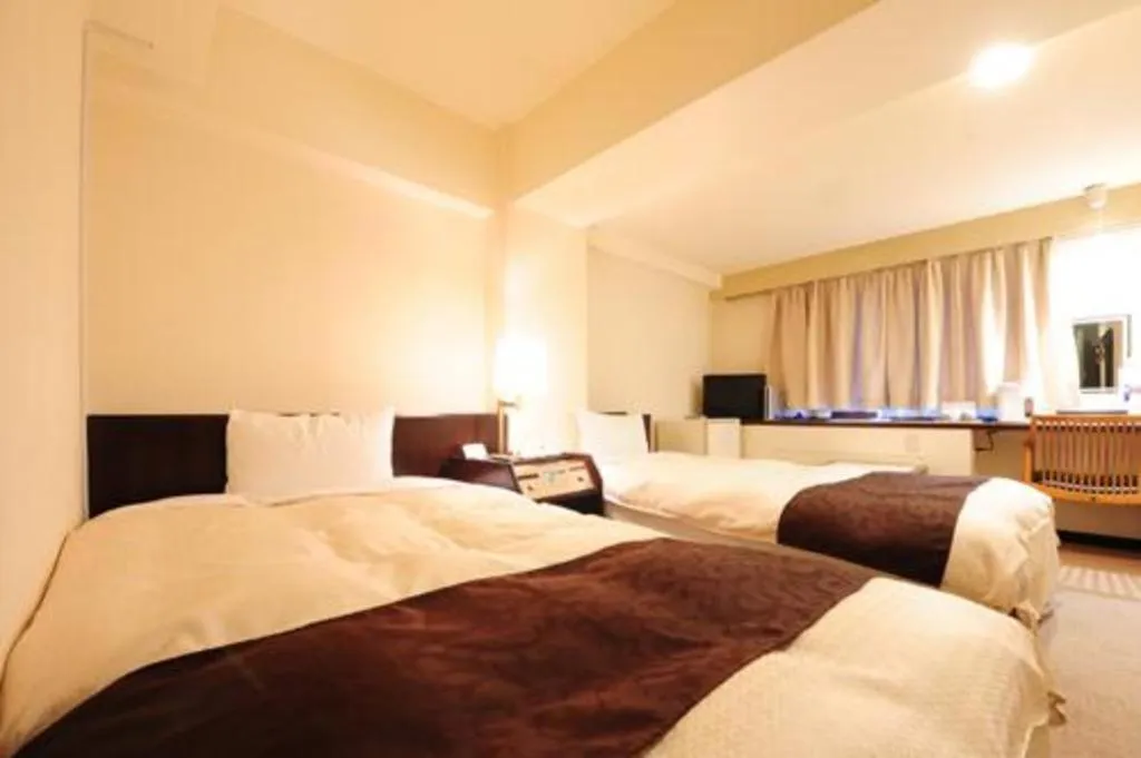 Bed in Hiroshima Kokusai Hotel