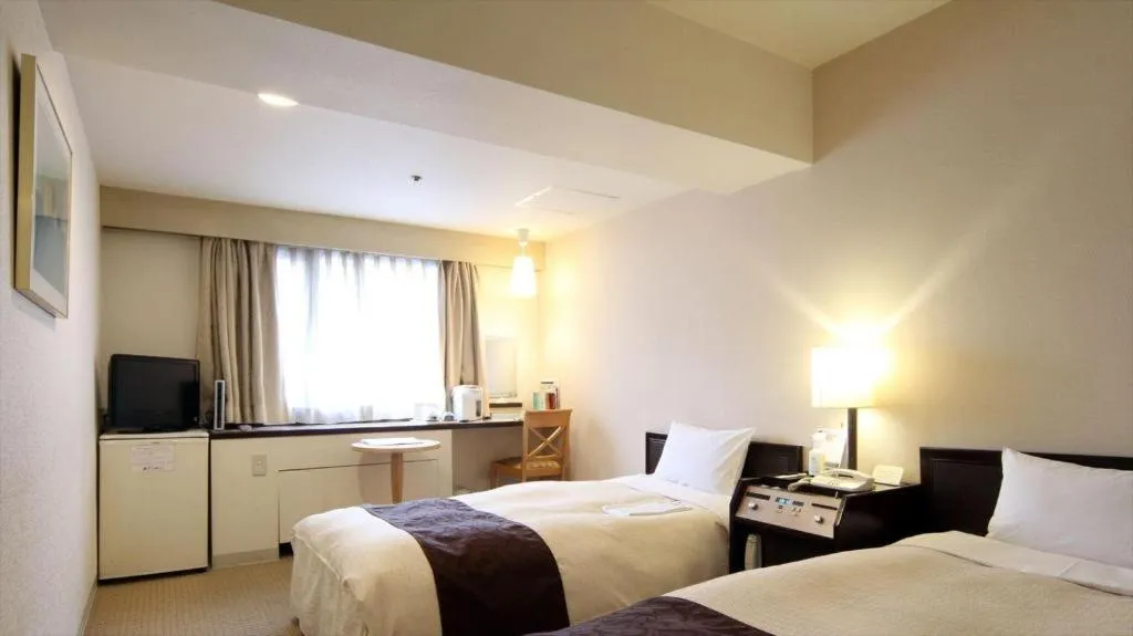 Bed in Hiroshima Kokusai Hotel