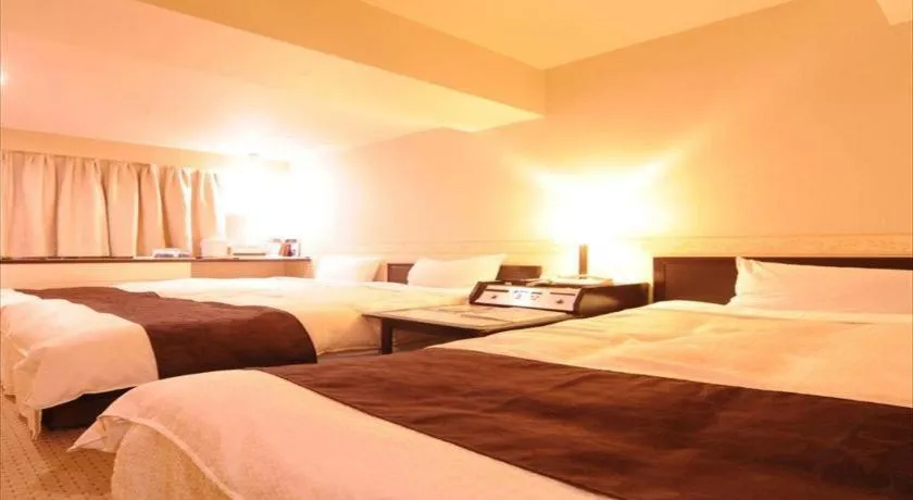 Bed in Hiroshima Kokusai Hotel