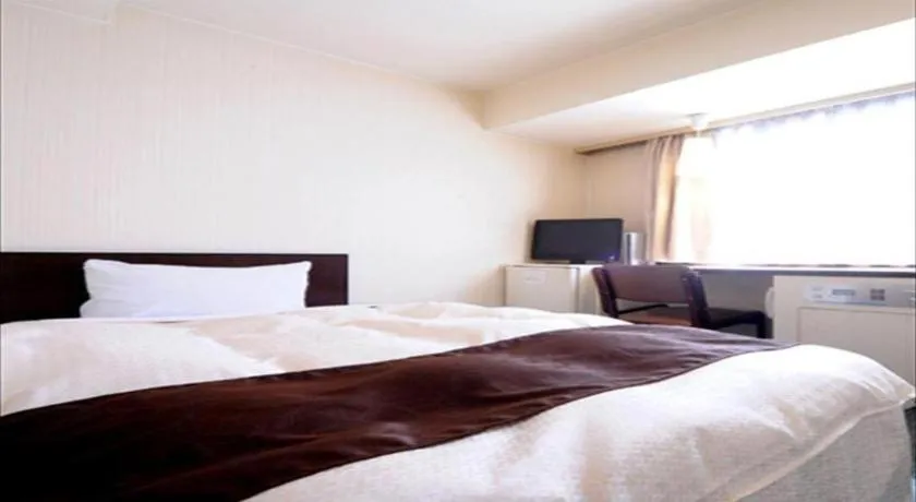 Bed in Hiroshima Kokusai Hotel