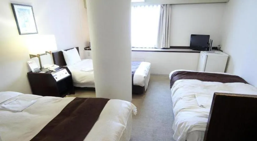 Bed in Hiroshima Kokusai Hotel