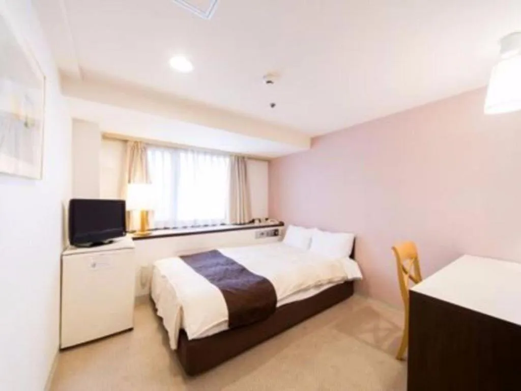 Bed in Hiroshima Kokusai Hotel