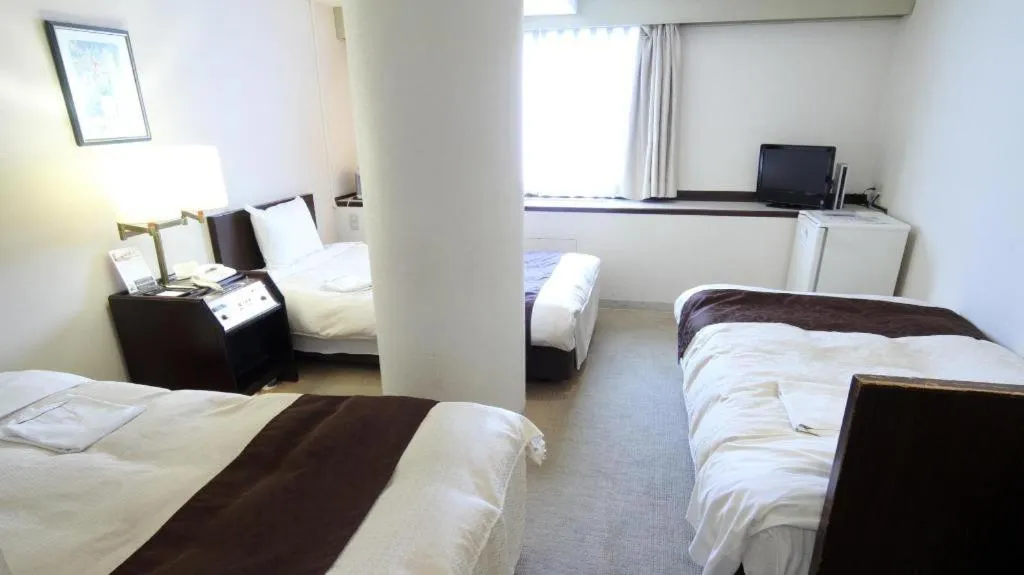 Bed in Hiroshima Kokusai Hotel