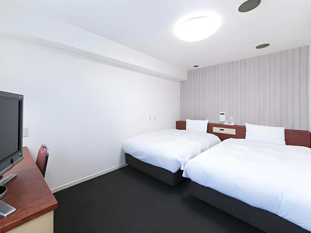 Bed in Pearl Hotel Kawasaki