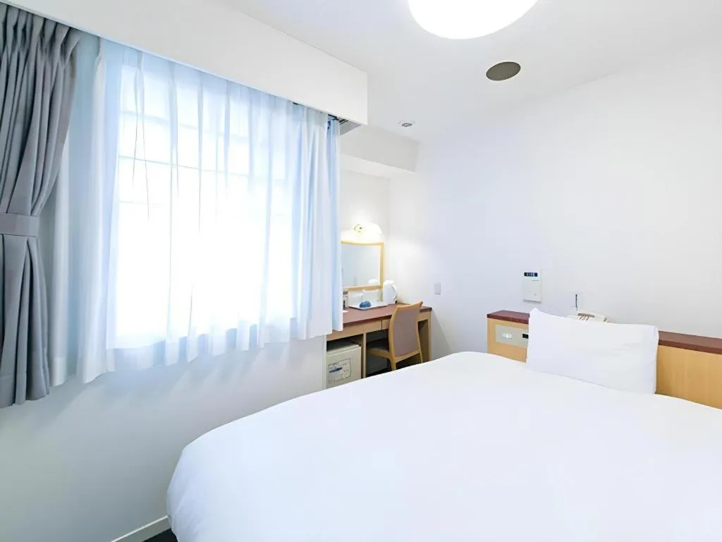 Bed in Pearl Hotel Kawasaki