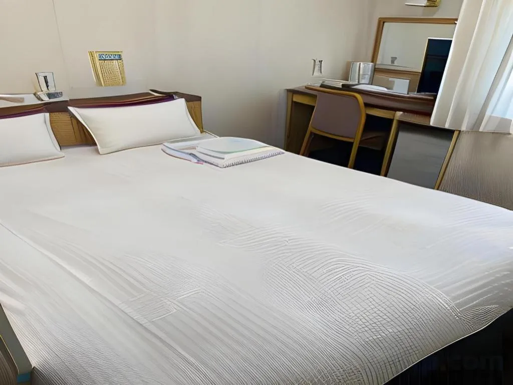 Bed in Pearl Hotel Kawasaki