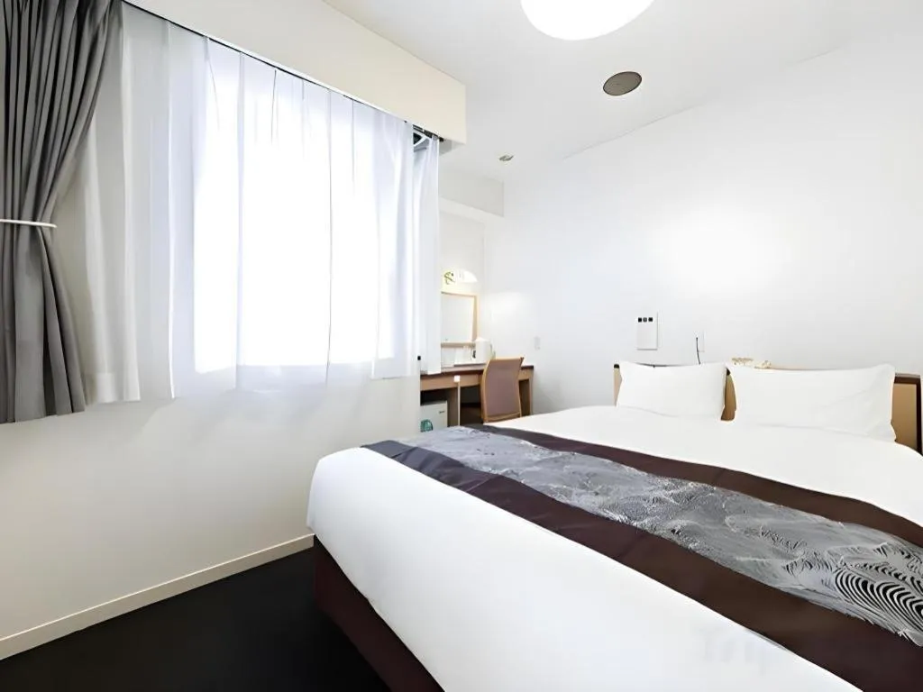 Bed in Pearl Hotel Kawasaki