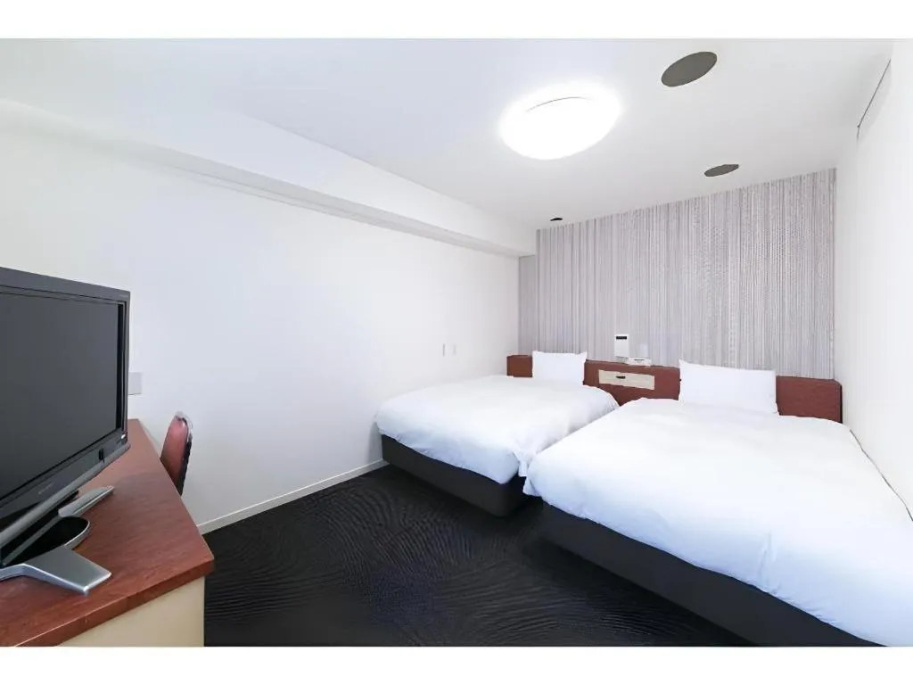 Bed in Pearl Hotel Kawasaki