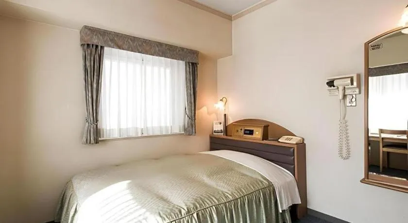 Bed in Hotel Starplaza Ikebukuro