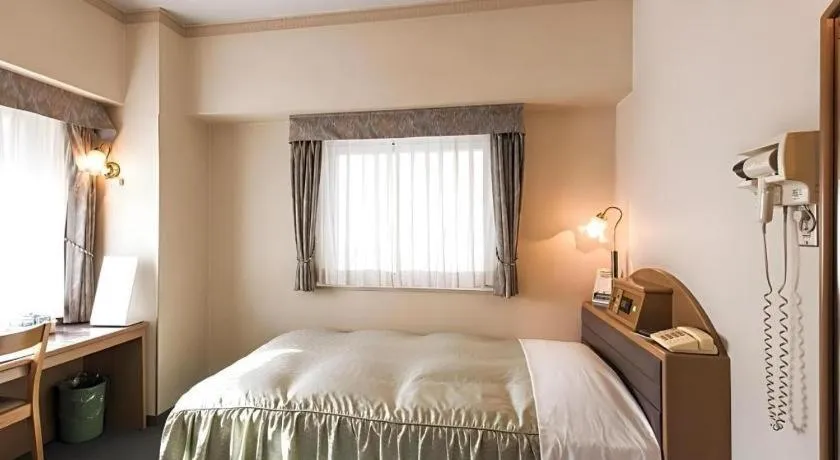 Bed in Hotel Starplaza Ikebukuro