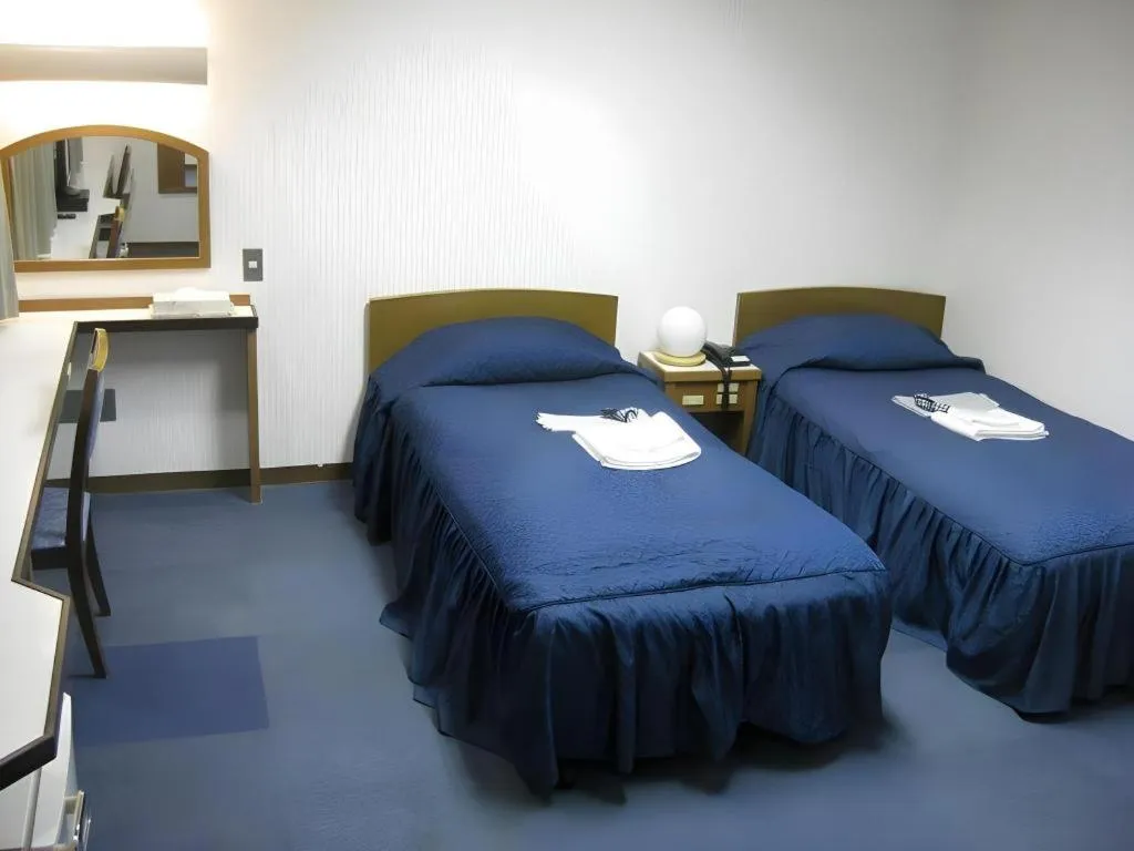 Bed in Tokyo Business Hotel